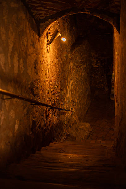 istock Entrance steps with small lighting to a stone cave 2212625729