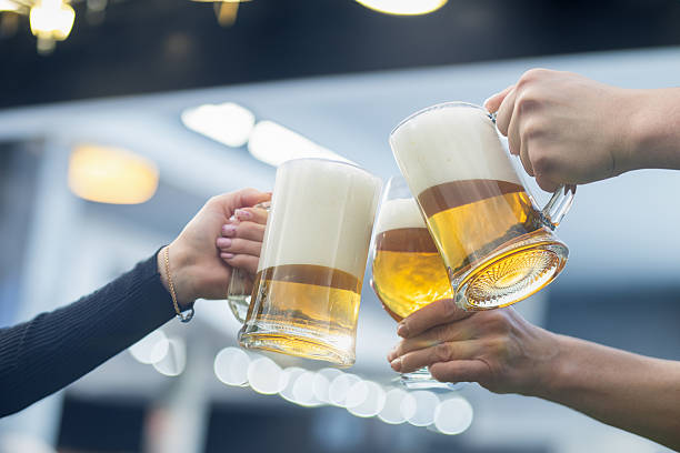istock Beer Toast at a party. 2212628272