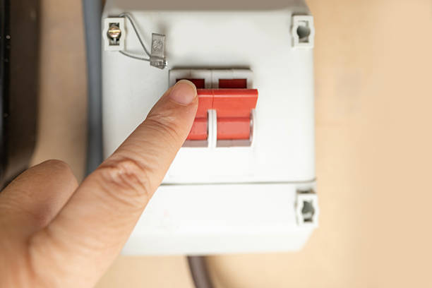 hand pressing light switch, energy saving, white background, turning off electricity, eco friendly, home control, Electrical safety demonstration, flipping power switch, minimal interior