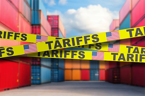 istock Tariffs highlighted at a busy shipping container yard in a bustling port area 2212633484