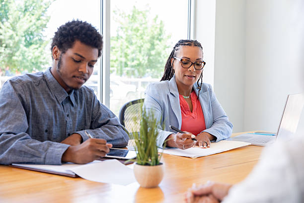 istock Diverse colleagues work together during meeting in modern board room 2212633960