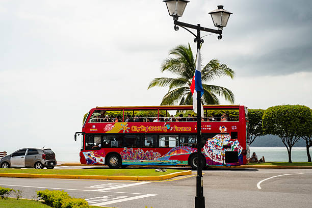 Panama City, Panama - February 16, 2025: A City Sightseeing Bus on the Amador Causeway heads toward the city from the docks.