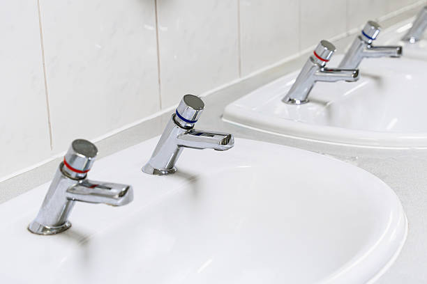 istock Separate Hot And Cold Water Taps In Public Bathroom 2212636768