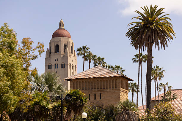 Palo Alto, California, USA - April 18, 2025: The landmark 1941 Hoover Tower dominates the campus skyline of Stanford University.