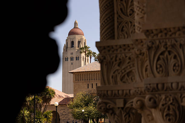 Palo Alto, California, USA - April 18, 2025: The landmark 1941 Hoover Tower dominates the campus skyline of Stanford University.