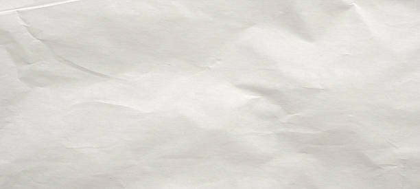 istock Abstract white crumpled and creased recycle paper texture background 2212649470