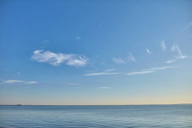istock Clouds over calm ocean under a clear blue sky in Denmark during a peaceful day 2212649577