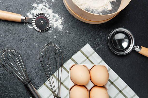 istock Preparing ingredients for baking with eggs and flour on a kitchen counter 2212650353