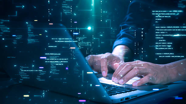 close-up of hands typing on a laptop with glowing programming code and binary graphics, symbolizing cybersecurity technology coding or software development. - teknologi bildbanksfoton och bilder