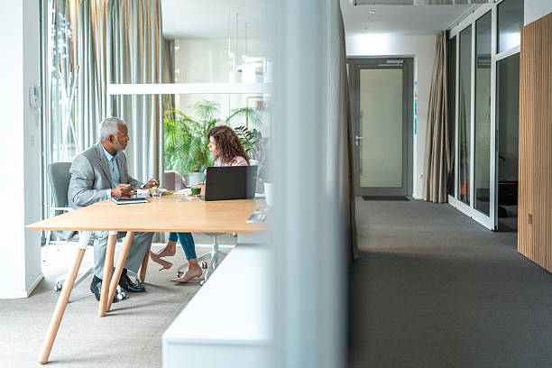 istock Diverse Corporate Colleagues Engage in Work Lunch 2212659907