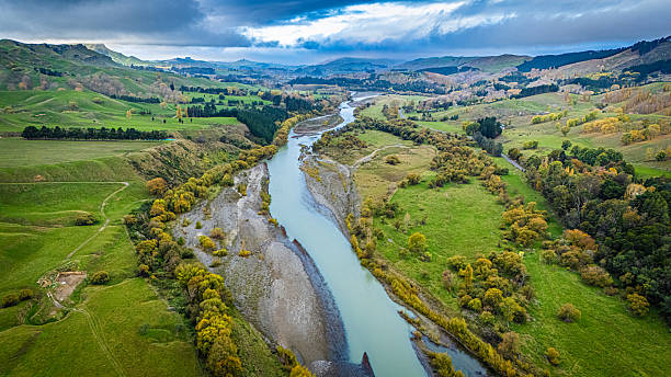 istock River through New Zealand countryside 2212660467