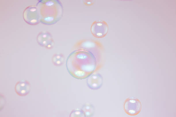 istock Beautiful Pink and Blue Soap Bubbles Floating in The Air. Celebration Festive Backdrop. Freshness Soap Suds Bubbles Water. Abstract Background. 2212662892