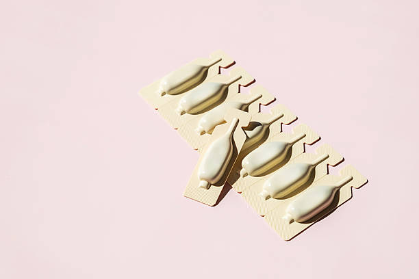 istock Suppositories in Blister Packaging Arranged on Pink. Medical and Pharmaceutical Concepts. 2212664385