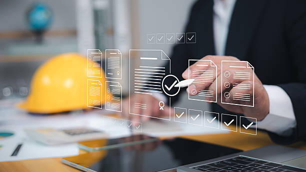 istock Approved buildings permit concept with approved residential building project, Construction project inspection, Architect or engineer Checking the list of documents and approving the project. 2212665833
