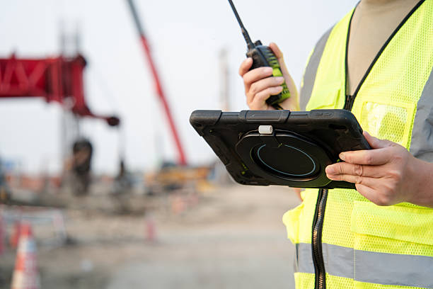 istock asian male engineer working with digital tablet in construction site 2212667549