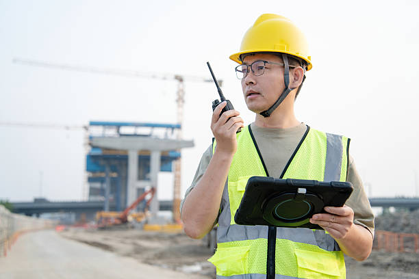 istock asian male engineer working with digital tablet in construction site 2212667561