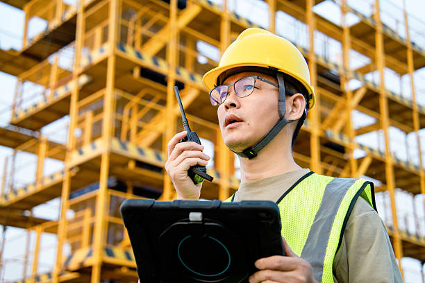 istock asian male engineer working with digital tablet in construction site 2212667651