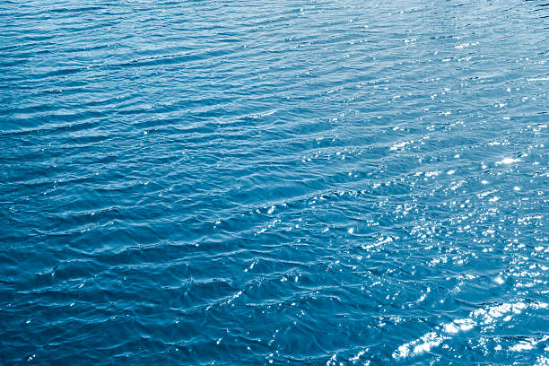 istock Blue water background texture. Breezy wavy seawater. Sea water texture. 2212668105
