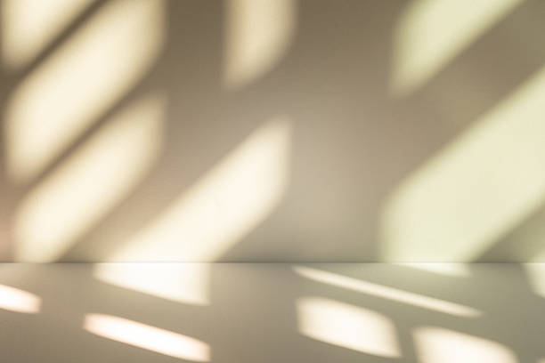 istock Studio style background wall decoration presentation uses white and beige tones. with shadows cast from a nearby window, concept creating a decorative 2212671284