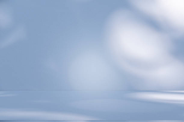 istock Studio style background wall decoration presentation uses white and blue tones. with shadows cast from a nearby window, concept creating a decorative 2212671312