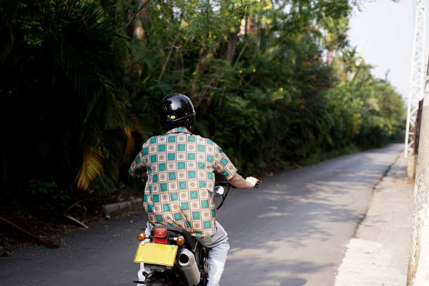istock The boy riding a motorcycle on the road 2212674710