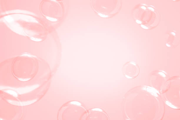 istock Beautiful Pink Soap Bubbles Floating in The Air. Celebration Festive Backdrop. Freshness Soap Suds Bubbles Water. Pink and White Gradient Textured. 2212675143