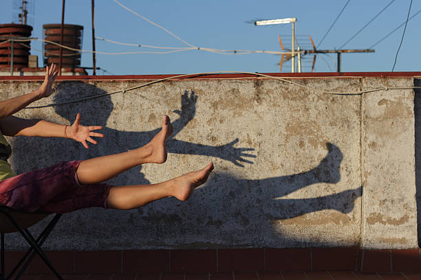 istock Engaging in Dynamic Shadow Play on Rooftops  A Blend of Art and Nature in Motion 2212675187