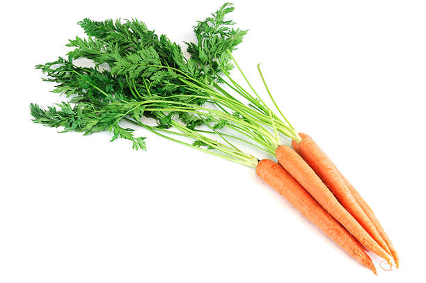 istock fresh carrot with leaves isolated on white background 2212675458