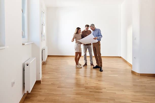 istock Examining blueprints of the apartment with an agent! 2212678202