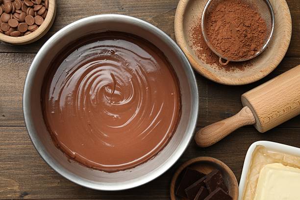 istock Chocolate dough in bowl and ingredients on wooden table, flat lay 2212678736