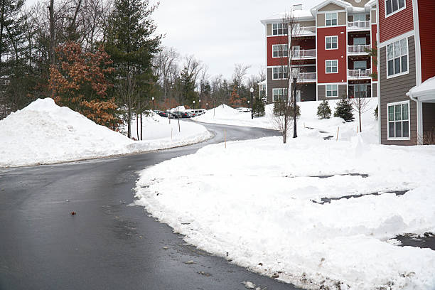 istock modern apartment building after winter snow storm 2212678977