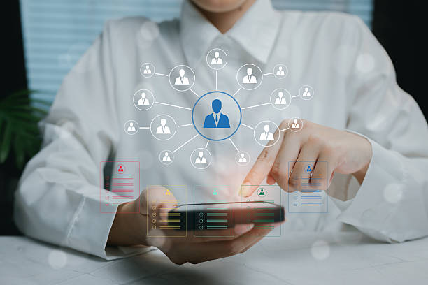 istock Woman Using Smartphone with Virtual Network Connections Displayed, business concept 2212681412