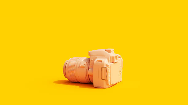 istock Camera Yellow Background Vivid Peach Tones 2212684148