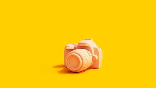 istock Camera Yellow Background Vivid Peach Tones 2212684171