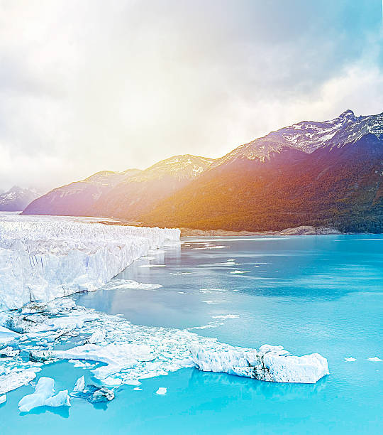 Perito Moreno Glacier with fog over mountains in sunlight