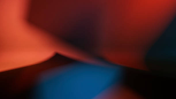 istock Abstract Gradient Background Showing Rich Colors of Red, Blue, and Black in a Dynamic Interplay of Light and Shadow 2212694794
