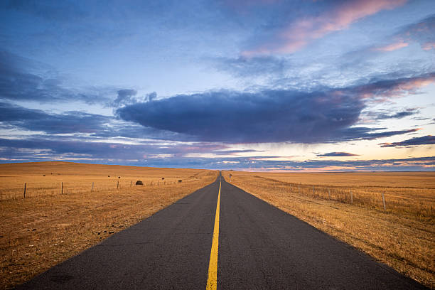 istock The serene landscape, with its golden grass and distant mountains 2212695190