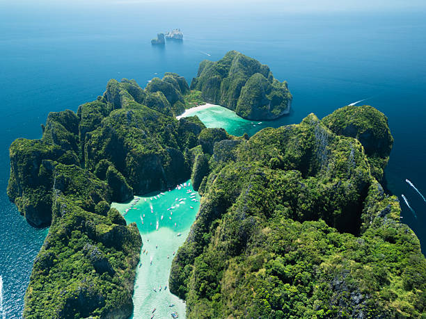 istock Drone Shot of Stunning Maya Bay in Ko Phi Phi With Lush Green Cliffs 2212698335
