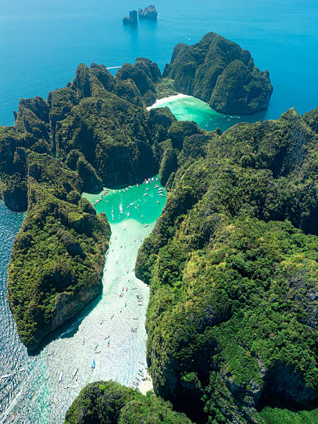 istock Drone Perspective of Turquoise Maya Bay Lagoon Enclosed by Rocky Cliffs 2212698774