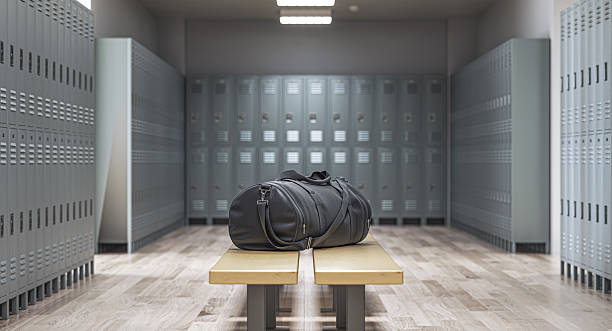 istock Sports bag sitting on bench in empty locker room 2212699662
