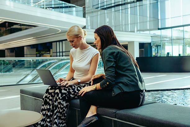 istock Two businesswomen collaborating on a project using a laptop 2212704166