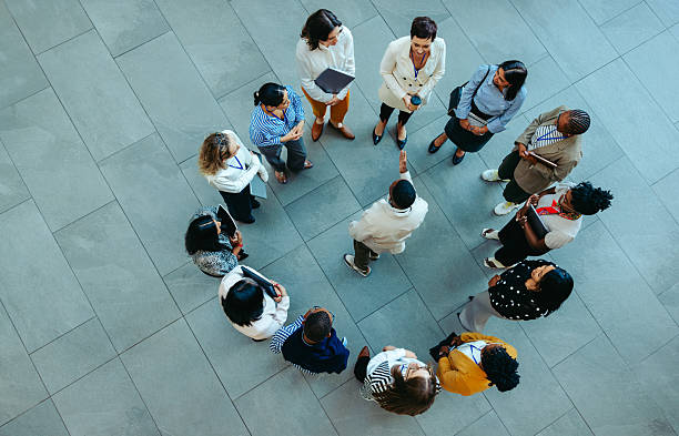 istock Top view of a corporate team huddle discussing onboarding and collaboration 2212704329