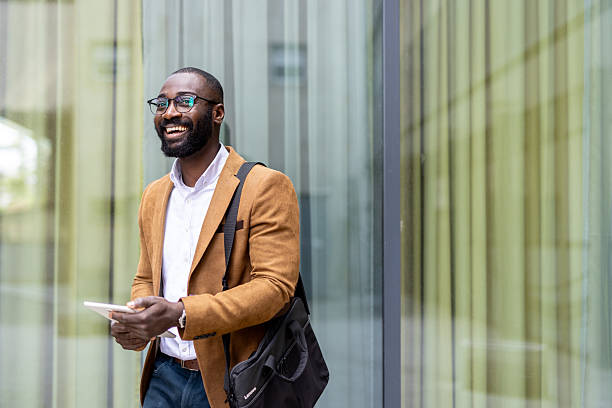 istock Excited Professional Holding Tablet Smiling Outdoors 2212704355