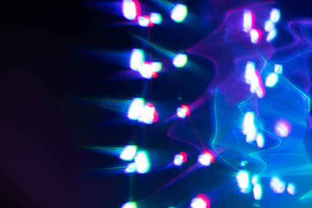 istock Colorful light leak on black background, abstract design with optical lens flare shot on a long lens 2212704592