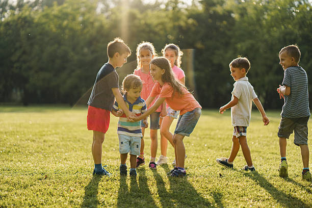 istock Children playing in public park 2212706645