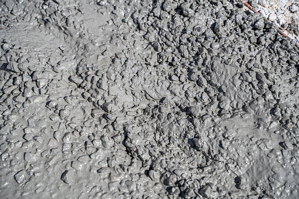 istock Fresh mixture of cement with crushed stone close-up 2212708146