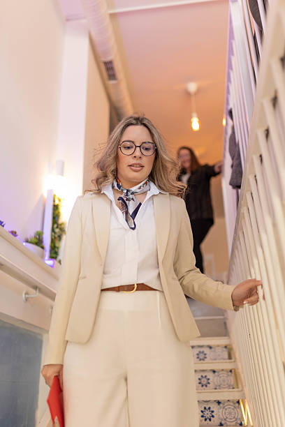 istock Businesswoman Standing on Restaurant Steps 2212708868