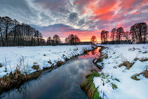 istock Beautiful winter sunset over the river banks 2212718092