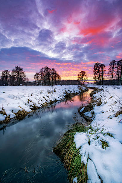 istock Beautiful winter sunset over the river banks 2212718093