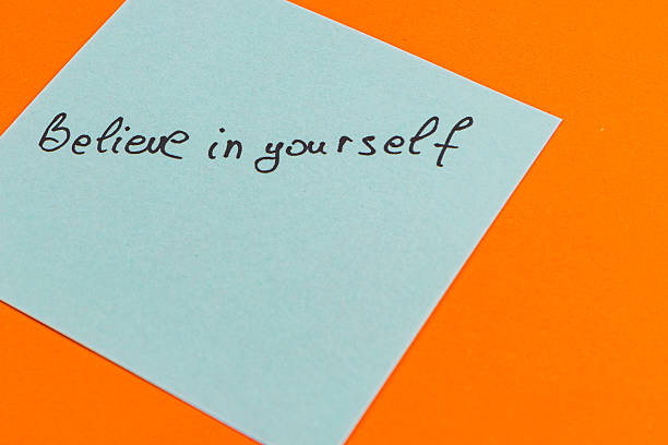 istock Inspirational note on a bright orange background promoting self-belief 2212722354